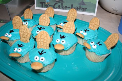 Phineas and Ferb Perry the Platypus cupcakes! by Sarah Merkel Perry The Platypus Cupcakes, Perry The Platypus Birthday Party, Phineas And Ferb Cupcakes, Phineas And Ferb Birthday Cake, Perry The Platypus Cake, Phineas And Ferb Party Ideas, Phineas And Ferb Birthday Party, Phineas And Ferb Party, Platypus Cake