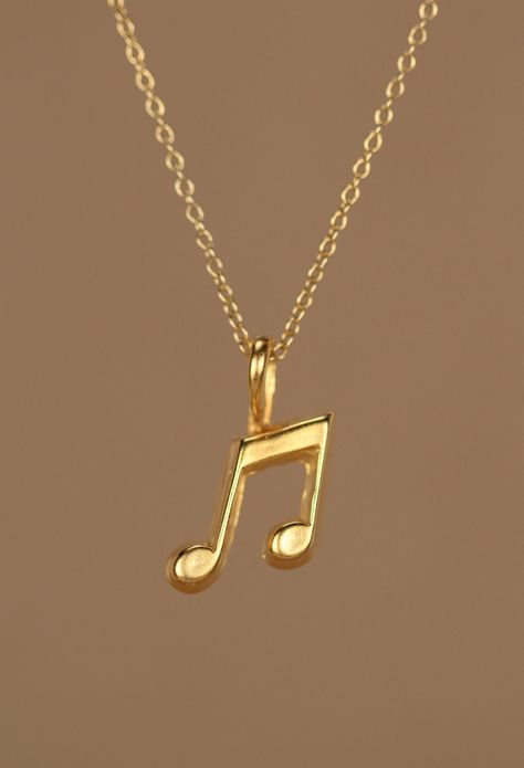 Gold music note necklace - music note - eighth note necklace - a 14k gold plated eighth note on a 14k gold filled chain This perfectly cute and tiny 14k gold plated sterling silver eighth note hangs happily from a 14k gold filled chain in the length of your choice! Please feel free to select a different length chain if you prefer! This beauty is also available in sterling silver.  The music note measures 12mm x9mm. Looking for other charm necklaces? https://www.etsy.com/shop/BubuRuby?section_id= Music Inspired Jewelry, Music Themed Jewelry, Necklace Music, Music Note Necklace, Nota Musical, Eighth Note, Pretty Jewelry Necklaces, Musical Jewelry, Music Jewelry