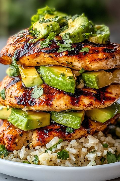 If you’re looking for a fresh and vibrant dish that’s perfect for summer, then this Honey Lime Chicken & Avocado Rice Stack is just what you need! This delightful meal features tender, marinated chicken layered with creamy avocado and fluffy rice, all drizzled with a zesty honey-lime dressing. It’s a wholesome and satisfying dish that’s not only delicious but also visually stunning! What makes this dish so special is the harmonious combination of flavors and textures. The sweet and tangy honey- Honey Lime Chicken Rice Stack, Honey Lime Chicken And Avocado Rice, Light Healthy Chicken Recipes, Dinner Ideas Avocado, Honey Lime Chicken Avocado Rice Stack, Lime Dinner Recipes, Chicken And Rice Healthy Clean Eating, Defined Dish Recipes, Lime Recipes Dinner