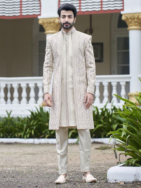 Luxury Bollywood Style Kurta For Groom, Luxury Sherwani With Naqshi In Straight Kurta Style, Luxury Tailored Sherwani For Reception, Luxury Yellow Sherwani For Transitional Season, Luxury Unstitched Off White Sherwani, Luxury Sherwani For Men For Puja, Luxury Straight Kurta Sherwani For Groom, Luxury Sherwani For Formal Events, Straight Kurta, Luxury Straight Kurta Sherwani For Formal Occasions