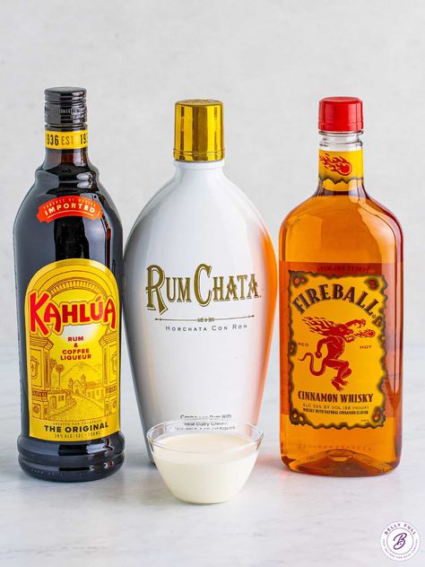 Made with Rumchata, Kahlua, and Fireball, this Cinnamon Roll Cocktail has all of the best flavors of the holiday season in one drink. Decadent, creamy, and so festive! Make one for yourself or a whole pitcher for a party. Rum Chata Fireball Shots, Fireball And Baileys Drink Recipes, Creamy Fireball Drinks, Rum Chata Fireball Drink Recipes, Fireball Rumchata Shots, Horchata Rum Cocktails, Fireball Rumchata Drink, Rum Chats And Fireball, Rumchata Fireball Drinks