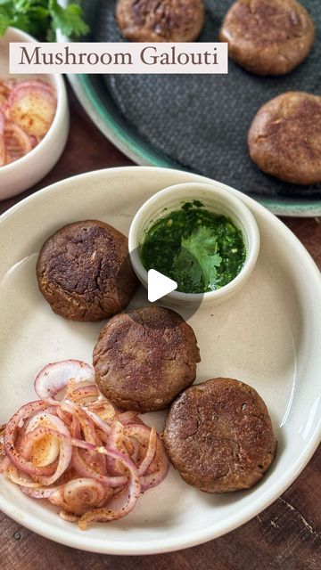 Sneha Singhi Upadhaya on Instagram: "Mushroom Galouti  These kebabs are so delicious & absolutely melt in the mouth. They're the perfect snacks for the monsoons. Let's make this.  Wearing : @prakassaofficial_  Makes 7-8 tikkis 3-4 tbsp ghee 3 onions, finely sliced 1/2 cup cashews  Heat ghee in a pan. Add the onions & cook till they brown. Remove them on a plate. In the same ghee, roast the cashews till they brown too. Remove & keep aside. If you want to make this healthier, you can also spray the onions with oil/ghee & cook it in the microwave for 5-6 minutes while mixing in between. And, dry roast the cashews instead of frying.  400 gms mushrooms Salt to taste  Water as required  1 tsp red chilli powder  Pinch of elaichi powder  1/2 tsp garam masala  2-3 tbsp besan Heat water in a pan & a Mushroom Galouti Kabab, Mushroom Kebab, Onion Paste, Perfect Snacks, Ghee Roast, Soup Starter, Red Chilli Powder, Green Chutney, Vegetarian Snacks