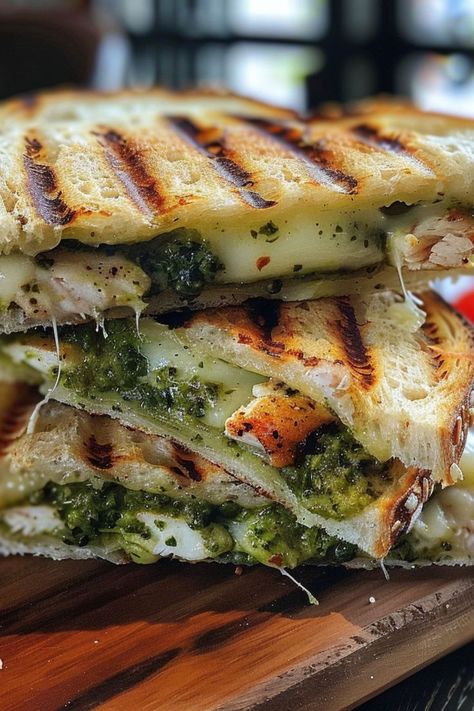 Chicken Pesto Panini is a delicious and gourmet choice for any mealtime! 🥪🍗 Made with tender chicken, creamy pesto, and melty cheese, this panini is a delightful blend of bold flavors and crispy, grilled texture. Quick to prepare and bursting with savory goodness, Chicken Pesto Panini is perfect for a satisfying lunch or a quick dinner. Indulge in this flavorful twist on a classic sandwich today! 😋🌿 #ChickenPestoPanini #GourmetSandwich #SavoryEats #QuickMeals Chicken Pesto Panini, Pesto Panini, Chicken Pesto Sandwich, Pesto Sandwich, Classic Sandwich, Chicken Pesto, Gourmet Sandwiches, Creamy Pesto, Melty Cheese