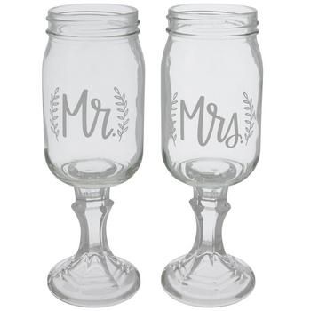 Details: 	 Dimensions: 8.75" H x 3.19" W x 3.19" D 	 Opening Diameter: 2.44" 	 Material: Glass 	 Color: Clear 	 Care & Safety: Hand Wash Only 	 Quantity: 1 - Mrs Glass & 1 - Mr Glass Add a touch of flair to your big day with these unique Mr & Mrs Mason Jar Toasting Glasses! These clear mason jar glasses feature a sturdy, round faceted base, a small neck, a round jar shape, and the words "Mr" and "Mrs" between two leaves on each glass. This matching pair will make your wedding day even more beaut Round Tables For Wedding Reception, Wedding Foods, Mason Jar Glasses, Frugal Wedding, Wedding Toasting Glasses, Auction Ideas, I Do Bbq, Toasting Glasses, Bbq Wedding