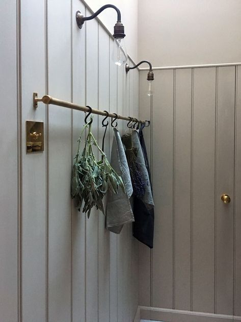 The pantry features a beautiful brass hanging rail Brass Hanging Rail, Brass Rail, Cloakroom Toilet, Devol Kitchens, English Kitchen, Boot Room, Utility Rooms, Old Kitchen, Hanging Rail