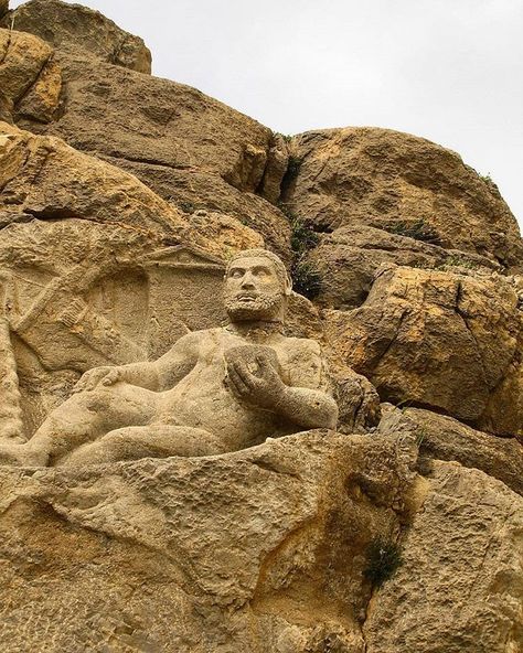 Statue of Hercules is located in Mount Behistun and was discovered around 1957. It was built in 153 BC during the time of the Seleucid Empire or the Parthian Empire. Hercules is lying on a 2 m long platform and holds a bowl in his left hand. He has put his right hand on his foot. The statue is 1.47 m long and is attached to the mountain. #ttp #tourtopersia #tourtoiran #ttp #tourtopersia #tourtoiran#architecture #travel #h info@tourtopersia www.tourtopersia.com Seleucid Empire, Parthian Empire, Zagros Mountains, Pagan Gods, Iran Travel, Ancient Statues, Ancient Mesopotamia, Ancient Technology, Amazing Places On Earth