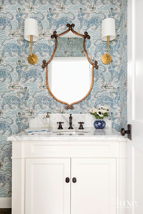 A Tudor-Style Home Redo Keeps The Vintage Charm | Luxe Interiors + Design Tibet Wallpaper, Victorian Home Bathroom, Powder Room Backsplash, Powder Room Vanity Ideas, Bathroom Wallpaper Inspiration, Bathroom Wallpaper Trends, Transitional Powder Room, Bathroom Wallpaper Modern, Accent Bathroom