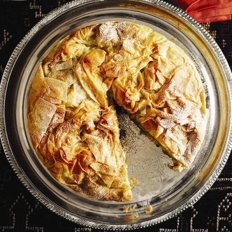 Moroccan-inspired Bastilla — a phyllo-crusted pie stuffed with chicken, almonds and herbs — and more dishes from around the globe at Chatelaine.com. Moroccan Dinner Party, Moroccan Dinner, Phyllo Pastry, Dinner Party Themes, Dinner Party Menu, Cooking Recipes Healthy, Easy Meal Plans, Moroccan Food, Dinner Themes