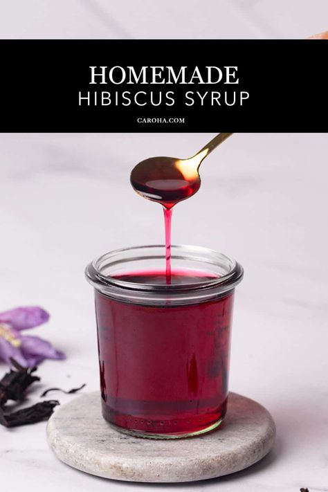 Hibiscus syrup in a glass jar being scooped. Hibiscus Simple Syrup Recipe, Hibiscus Recipe, Hibiscus Cocktail, Hibiscus Drink, Hibiscus Syrup, Natural Food Dye, Ginger Cocktails, Flower Desserts, Cocktails And Mocktails