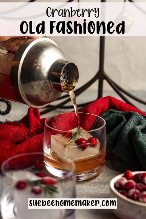 Indulge in the holiday spirit with a classic Christmas Old Fashioned. This seasonal libation features bourbon, cranberry juice, and a touch of simple syrup poured over substantial ice cubes. Take a moment to savor the festive flavor! Holiday Ice Cubes Cocktails, Christmas Ice Cubes, Fun Christmas Cocktails, Christmas Old Fashioned, Whiskey Ice Cubes, Flavored Ice Cubes, Flavored Ice, Old Fashioned Drink, Whiskey Ice