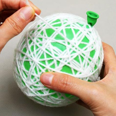 Yarn or String Christmas Ornaments | Kids' Crafts | Fun Craft Ideas | FirstPalette.com Yarn Ornaments Diy Kids, Yarn Christmas Crafts For Kids, Christmas Yarn Crafts, String Ornaments, Ornaments Diy Kids, Yarns Ornaments, Fun Craft Ideas, Light Bulb Ornaments, Yarn Balls