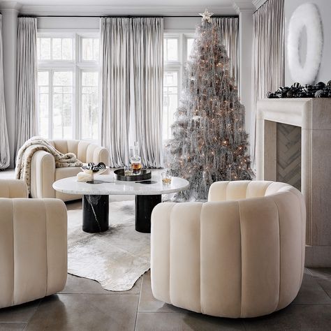 Fitz Modern Cream Velvet Swivel Chair + Reviews | CB2 Downswept Christmas Tree, Oval Marble Coffee Table, Flocked Christmas Tree, Feather Wreath, Pine Christmas Tree, Modern Accent Chair, Accent Arm Chairs, Silver Tree, Marble Coffee Table