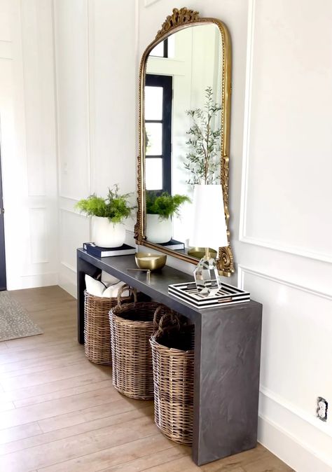 Vintage Mirror Entryway Ideas, Black And Brass Console Table, Entry Way Table Mirror, Black Console Table With Mirror, Vintage Mirrors Entryway, Anthropologie Mirror Entry Way, Entry Console Table Gold, Alice Lane Entryway, Gray Console Table Entryway