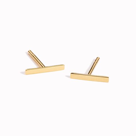 These gold bar stud earrings bring an understated edge to just about any outfit. Bar measures at 9mm long. Outfit Bar, Gold Bar Earrings Studs, Bar Stud Earrings, Bar Studs, Sustainable Jewelry, Bar Earrings, Gold Bar, Traditional Jewelry, Recycled Gold