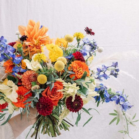 a fun fall bridal bouquet featuring bright colors and many native Mexican flowers. These include marigolds, dahlias, zinnias, passion flower vine, chocolate cosmos, and more. Passion Flower Vine, Flower Making Crafts, Marigold Wedding, Native Mexican, Fall Bridal Bouquet, Dahlias Wedding, Chocolate Cosmos, Dahlia Bouquet, Mexican Flowers