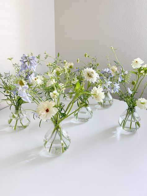 Delicate Flower Centerpiece, Blue Simple Wedding Decor, Bud Vase Blue Flowers, Blue Flower Bud Vase, Blue Wildflower Centerpieces, Simple Blue And White Bouquet, Flower In Small Vase, Flower Center Piece For Tables Simple, Bud Vases White And Blue Flowers