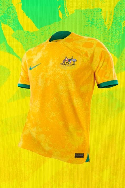 Australia’s new 22/23 home top was intended by Nike to evoke Australia’s unique ecosystems. Through “University Gold, Tour yellow and Green Noise,” the home kit conjures the rugged, sandy landscape of the Outback and the rich wetlands and forests that encompass the island continent. Australia Soccer Team, Netherlands World Cup, Nike 2022, Usa World Cup, England National Football Team, World Cup Kits, World Cup Jerseys, Brazil World Cup, 2022 World Cup