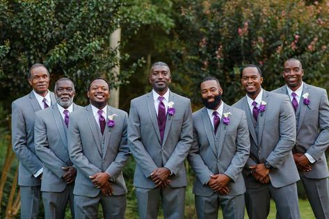 Light gray suits and royal purple ties Grey And Purple Tuxedo Wedding, Wedding Suits Men Grey Purple Bridesmaid Dresses, Royal Purple Groomsmen Attire, Grey And Purple Wedding Theme, Purple And Gray Outfits, Grey Suit Purple Shirt, Gray Suit Purple Tie, Grey Suit With Purple Tie, Grey Suit Purple Tie