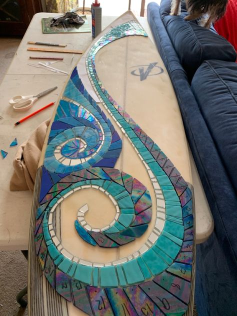 Stained glass mosaic of waves and sunshine still to come Surf Mirror, Mosaic Surfboard Ideas, Surfboard Mural, Mirror Surf Board, Surfboard Furniture, Surfboard Art Decor, Seaside Nursery, Mandala Surfboard Art, Custom Surfboard Art