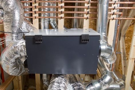 Here's How to Make Sure Your Air Exchanger Is Working Properly | Hunker Air Exchanger, Heat Recovery Ventilation, Exhaust Fans, Simple Machines, Heat Exchanger, Duct Work, Garbage Bag, Indoor Air Quality, Home Repairs