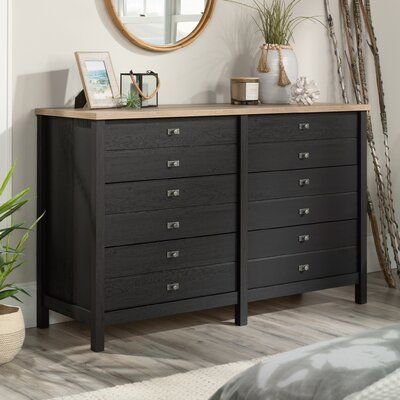 A modern dresser should have style and function at the forefront of its design. This bedroom dresser features six spacious drawers that open and close on smooth metal runners for easy access to storage of a variety of different items from stacks of slacks and button-up shirts to your collection of leggings and cozy sweatshirts. Each drawer is detailed with attractive hardware that gives it an extra touch of style. The spacious top surface of this double dresser provides you with additional space Drawer System, Black Dresser, Drawer Bedroom, Black Dressers, Laminated Mdf, Bedroom Essentials, Bedroom Dresser, Wood Dresser, Bedroom Furniture Dresser