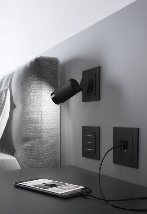 Lighten up: Plug & Light | News Black Light Switch, Bed Reading Light, Bedroom Reading Lights, Modern Light Switches, Hotel Room Interior, Headboard Lamp, Light Switches And Sockets, Hotel Room Design, Smart Home Design