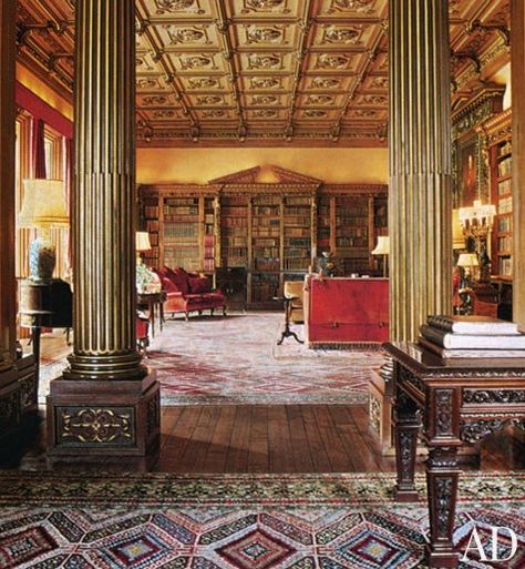 Tall gilded columns serve to divide the long axis of the library. The rich tones of the coffered wood ceiling and Caucasian rugs give the room a warm Victorian feeling. On the far wall, a massive double-pediment bookcase is filled with old books, their fine leather bindings creating an additional pattern. Highclere Castle Interior, Real Interiors, Downton Abbey House, The Real Downton Abbey, Downton Abbey Fashion, Hampshire England, Highclere Castle, Downton Abby, Castles Interior