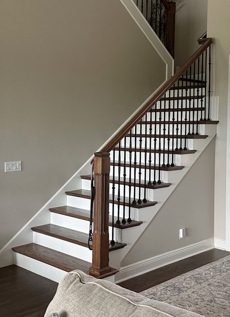 Learn how to pick the best paint color for dirty walls. Shown here, Sherwin Williams Accessible Beige with Alabaster trim, stairs with wood treads and railings, metal spindles, dark wood floor, white risers. Room decor ideas and paint color blogger What Color Paint Goes With Dark Wood Floors, Sherwin Williams Paint Colors For Dark Floors, Light Floor Dark Stairs, Beige Painted Stairs, Sherwin Williams Paint Colors With Dark Wood Trim, Accessible Beige And Alabaster, Best Paint Colors With Dark Wood Trim Sherwin Williams, Trim Stairs, Alabaster And Accessible Beige