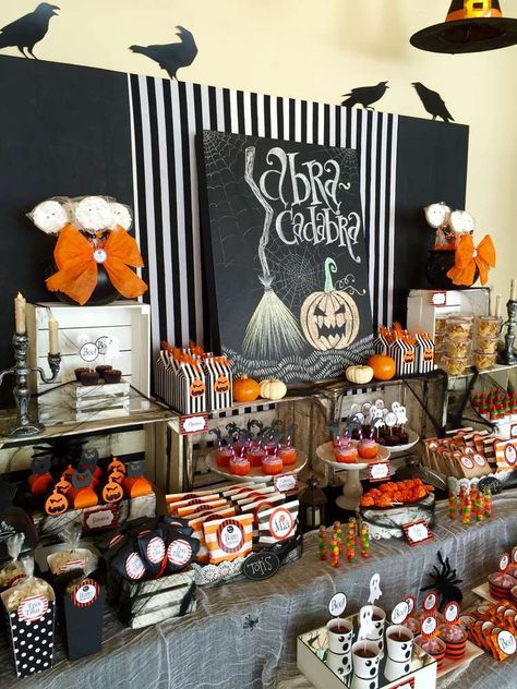 AbraCadabra! | CatchMyParty.com Halloween 60th Birthday Party, Halloween Dessert Table Decor, Halloween Office Party Decorations, Lds Halloween Ward Party, Hallowine Party Ideas, Halloween Desert Table, Halloween Candy Table Ideas, Halloween Dessert Table Ideas, Halloween Party Table Setup