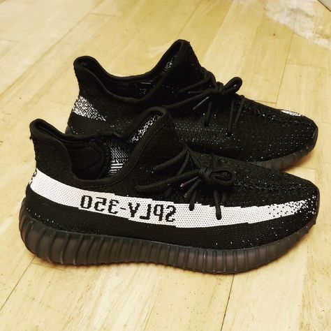 Adidas and Kanye West continue their black-based V2 lineup with the release of the adidas Yeezy Boost 350 V2 "Black/White." The sneaker features a core black Primenknit upper with subtle white accents and a white stripe that reads "SPLY 350." Release date was December 17, 2016 at a retail price of $220 real/$50 fake. Yeezy Sply 350, Yeezy Shoes Outfit, Sply 350, Yeezy Boost 350 V2, Shoes Outfit, Yeezy 350, Yeezy Shoes, December 17, Adidas Yeezy Boost 350