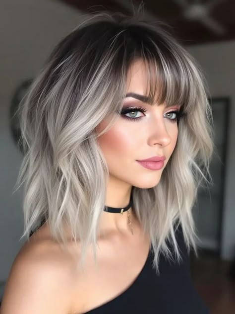 24 Stunning Winter Hairstyles with Bangs for 2025: Fresh Looks and Pro Tips Cruella Deville Hair Color, Platinum Asymmetrical Bob, Black Tip Hair Blonde, Silver Blonde Hair With Bangs, Gray Ombre Hair Short, Platinum Bangs Dark Hair, Easy Styling Haircut, Grey And Dark Brown Hair, Short White And Black Hair