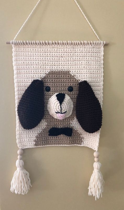 Handmade wall hanging of puppy dog. Perfect for nursery or child’s room. Can be made in the colors of your choice as available. Height of wall hanging is 14inches, with hanger 24 inches and with tassels 31 inches. Width is 14 inches. Crochet Wall Hanging Patterns, Crochet Nursery Decor, Wall Decor Kids Room, Crochet Wall Art, Crochet Wall Hanging, Baby Wall Decor, Crochet Nursery, Crochet Christmas Stocking, Crochet Animal Amigurumi