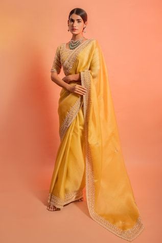 10326074PRICEIN Haldi Outfit, Indian Designer Sarees, Embroidered Crop Tops, Yellow Saree, Indian Sarees Online, Designer Sarees Online, Embellished Blouse, Saree Trends, Party Wear Indian Dresses