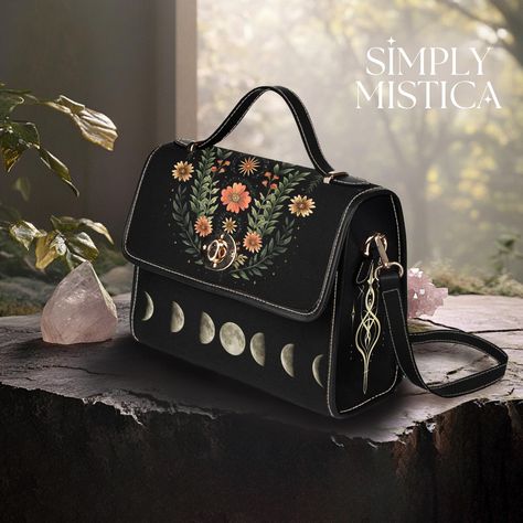 BLACK SACHEL BAG   Moonphase Satchel Purse (Vegan Leather Bag Darkacademia Hand bag vegan leather purse dark academia outfits satchel handbag shoulder bag) ・・・・✦・・・・✦ ・・・・✦・・・・✦ ・・・・✦・・・・✦ ・・・・✦・・・ Product Details     ⋆   Size & Material: This bag weighs about 19 ounces and is made from strong, waterproof canvas that lasts a long time.     ⋆   Ways to Use: You can use it for many things--carrying a laptop, taking to school, traveling, or even as a business bag. It also works as a crossbody bag.     ⋆   Storage & Straps: Inside, there are two small pockets and one zippered pocket to keep your things organized. The shoulder strap can be removed or adjusted to fit you. The strap color is black.     ⋆   Bag Size: 10.63 inches long, 4.13 inches wide, and 7.87 inches tall. ・・・・・・・・ ・・・・・・・・ ・・・・ Dark Academia Outfits, Academia Outfits, Vegan Leather Bag, Business Bag, Satchel Purse, Satchel Handbags, Black Bag, Leather Purse, Hand Bag