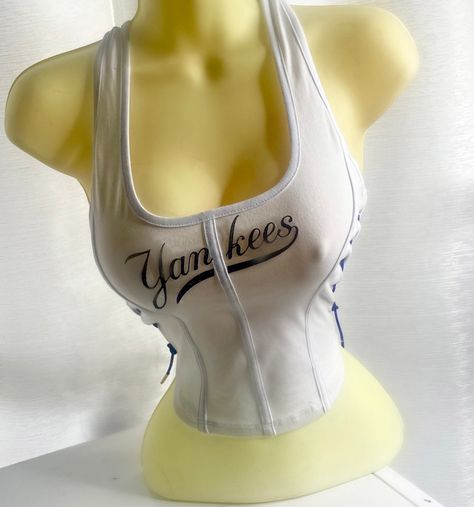 NY Yankees Corset Top with side rhinestone lace with blue lace.  Please note estimated time to ship these items is 7-10 business days as they are made to order. If you need it right away please send us a message and we will try our best to accommodate your request.  Don't see your team? Send us a message with a request and we will gladly accommodate it. Cute Jersey, Jersey Crop Top, Colour Combinations Fashion, Bratz Inspired Outfits, Top Corset, Lace Corset Top, Cute Shirt Designs, Ny Yankees, Cute Crop Tops