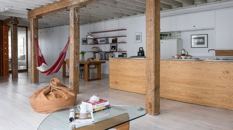 Loft Apartment by PlumGuide | HomeAdore Hammock Indoor, Modern Loft Apartment, Warehouse Interior, Indoor Hammock, Loft Decor, Basement Bedrooms, Modern Loft, Wooden Beams, Loft Apartment