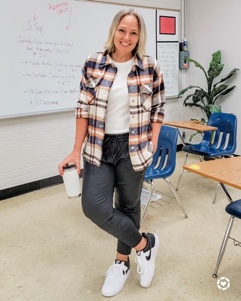 Casual everyday fall winter teacher weekend mom outfit featuring a plaid wool flannel shacket shirt jacket, faux leather like joggers, a white tank top, and bold white and black Nike sneakers #teacher #mom #petite #shacket #flannel #joggers #leatherjoggers #fauxleatherjoggers #basketballshoes #sneakers #Casual #fall #winter #midsize #whiteandblack http://liketk.it/3pd1M @liketoknow.it #liketkit Teacher Outfits With Nike Sneakers, Teacher Flannel Outfit, Midsize Sneaker Outfit, Sneaker Teacher Outfit, Teacher Jogger Outfits, Midsize Teacher Outfits, Black Nike Sneakers, Black And White Flannel, Teacher Outfits Fall