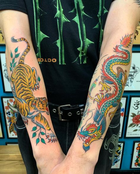 ⚡️ Double trouble ⚡️ Both Tiger and Dragon forearm tattoos in one day Bernard Kwok in the studio every Thursday to Saturday, knocking it out the park with these 2 immense pieces ! Call to book in or drop by to check out available designs for inspo Colourful Tattoos Men, Japanese Color Tattoo, Color Forearm Tattoo, Old School Dragon Tattoo, Traditional Japanese Tiger Tattoo, Tiger Tattoo Forearm, Traditional Dragon Tattoo, Dragon Tattoo Forearm, Dragon Tiger Tattoo