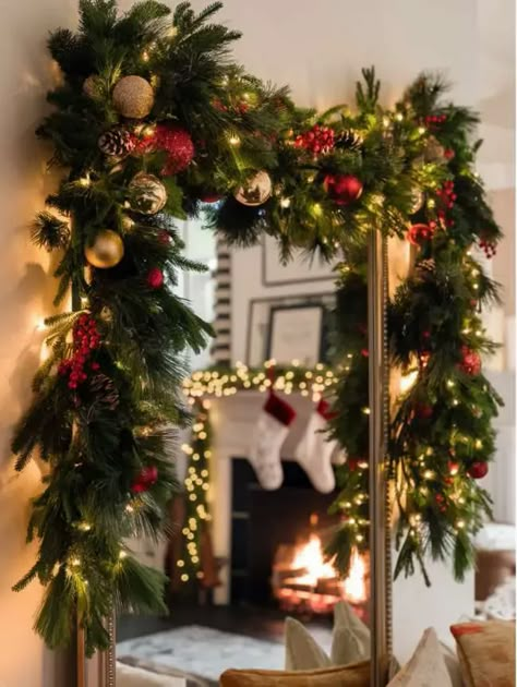 Festive Garlands Large Window Christmas Decorating Ideas, Christmas Garland Over Mirror, Christmas Garland Mirror, Decorate Mirror For Christmas, Apartment Porch Christmas Decor, Mirror Garland Christmas, Mirror Christmas Decor Ideas, Christmas Mirror Decorations Ideas, Christmas Mirror Decor