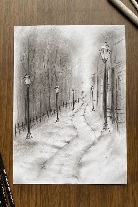 A pencil sketch of a winter evening park scene with lampposts lining a snow-covered path, leading past bare trees and a cottage. Winter Drawings Ideas, Simple Sketch Ideas For Beginners, Winter Drawings Christmas, Winter Drawing Ideas Sketch, Christmas Drawings Aesthetic, Winter Season Drawing, Winter Tree Drawing, Winter Art Ideas, Snow Sketch