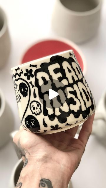 ✨💗Ugli Mug Ceramics💗✨ on Instagram: "One of my favorite pieces from the May batch, and still applicable 😵 I will be tying up some loose ends on the Halloween release this week, and afterwards, there are still two firings to go! What are you getting into? 👻🪦👻 . . . . . . . . . . . . . . . . . . . #mugshotmonday #mug #mugs #pottery #ceramics #ceramic #potterylove #handmade #functionalart #handmadeart #handpainted #underglaze #stoneware #collectibles #weirdart #spoopy #spookyseason #halloween #goth #gothaesthetic #gothgoth #gothstyle #gothart #darkart #darkarts #ghost #emo #emostyle" Halloween Pottery Ideas Painted, Goth Pottery Painting, Clay Mug Ideas Design, Underglaze Mug, Diy Mug Painting, Halloween Pottery Painting, Harry Potter Ceramics, Emo Painting, Halloween Pottery Ideas