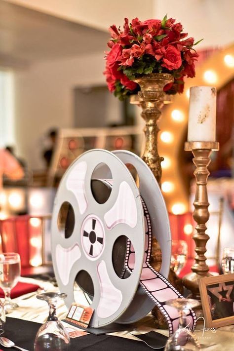 Hollywood Swag Bag Ideas, Movie Reel Centerpiece, Movie Party Centerpieces, Movie Themed Table Centerpieces, Old Hollywood Glam Theme Party, Movie Night Centerpiece Ideas, Hollywood Themed Centerpieces, Oscar Party Centerpieces, Cinema Party Ideas