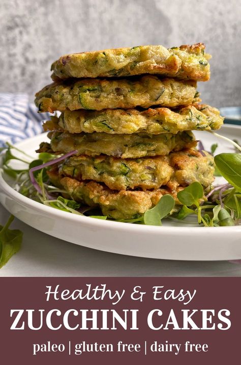 These healthy zucchini cakes are gluten free, paleo friendly and unsweetened. They're great for a healthy breakfast or side dish and super easy to make. These savory fritters are made with zucchini and onions, fresh herbs and cassava flour. #zucchini #fritters #paleo Cassava Zucchini Bread, Zucchini Fritters Gluten Free, Aip Zucchini, Savory Fritters, Paleo Zucchini Recipes, Zucchini Cake Healthy, Zucchini And Onions, Zucchini Cakes, Gluten Free Pancake Mix