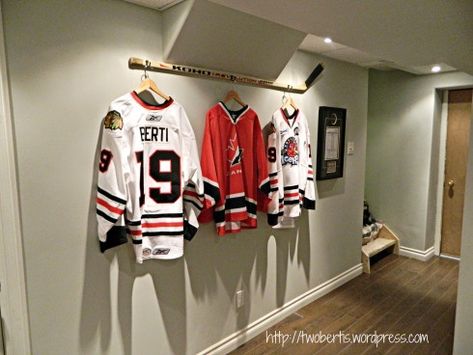 hang your jersey off of a stick in your hockey basement Hockey Man Cave, Sports Pictures Display, Hockey Bedroom, Hockey Room, Hockey Decor, Ideas Habitaciones, Jersey Display, Man Cave Basement, Hockey Stuff