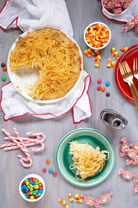 Buddy the Elf's spaghetti pie combines pasta with maple syrup for a surprisingly sweet dish. Eat with candy, candy canes, candy corns, and syrup! #buddytheelf #fourmainfoodgroups #christmasbreakfast #christmasmovies Buddy The Elf Spaghetti, Elf Spaghetti, Spaghetti Pie Recipe, Spaghetti Pie Recipes, Hanukkah Dinner, Overnight Recipes, Spaghetti Pie, Slow Cooker Stew, Vegetarian Bake