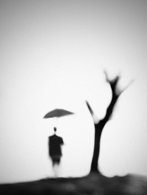 This photo is interesting because there is no background, just the tree, the person and the umbrella which looks like it is floating because the stick is out of focus and cannot be seen. Blur Photography, Figurative Abstract, Focus Photography, Pretty Pics, Out Of Focus, Visual Poetry, Dark Photography, 판타지 아트, Abstract Photography