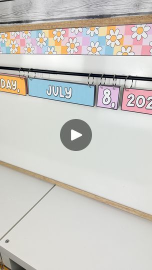 82K views · 5.6K reactions | ☁️ Let’s make a flip calendar! ☁️  Flip calendars are a great way to show the date without having to write every single day!   I use a magnetic shower curtain rod and binder clips to put it all together. This printable set matches perfectly with my Pastel Dreams Classroom Decor. It includes this funky font and a traditional primary font. But it is totally text editable through PowerPoint to change the font or language.   👇 Comment “calendar” below and I will DM you a link.   #classroom #classroomideas #classroomdecor #classroompinspirations #teachers #teachersofinstagram #pastelclassroom #teachertips #teachertipsandtricks | Kim McNeil | Classroom Decor 🌿 | Mentol · Yellow Creative Birthday Charts For Classroom, Flip Calendar Classroom, Flip Calendar, Funky Fonts, Classroom Calendar, Shower Curtain Rod, Diy Calendar, Binder Clips, Shower Curtain Rods