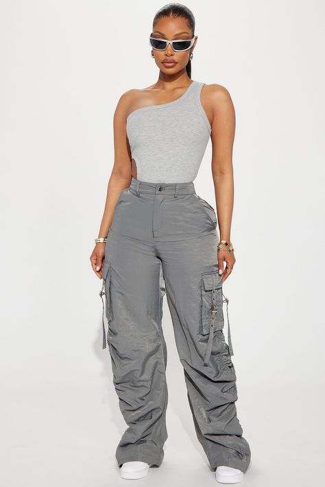 Available In Charcoal And Olive. Jogger Pant High Rise Button & Zip Closure Cargo Pockets Strap Detail Stacked Detail Toggles At Hem 100% Nylon Imported | Over It Stacked Cargo Jogger Pant in Charcoal size Medium by Fashion Nova Charcoal Joggers Outfit, Cargo Jeans Outfit Women Casual, Spring Outfits Street Style 2024, High Rise Cargo Pants Outfit, Loose Cargo Pants Outfit, Cargo Outfits Women, Cargo Outfits, Jogger Outfit, 90’s Outfits