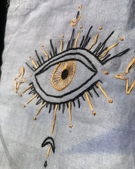 Cool Hand Embroidery, Eye Fashion Clothes, Embroidery Eyes Tutorial, Button Down Shirt Aesthetic, Eye Embroidery Pattern, Golden Embroidery Design, Evil Eye Embroidery Design, Embroidery Evil Eye, Eye Let Hole Embroidery Designs