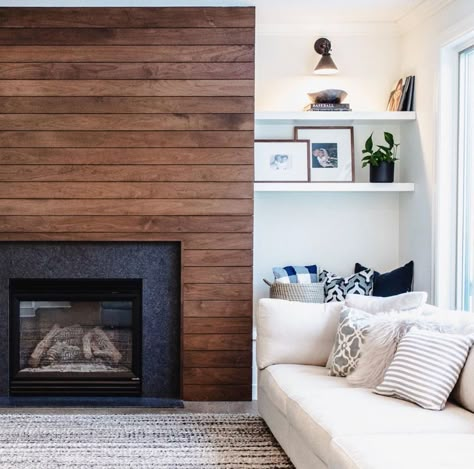 Modern fireplace surround with horizontal wood paneling and open bookcase shelving Walnut Shiplap, Wood Fireplace Surrounds, Mantel Styling, Gas Fireplace Insert, Fireplace Remodel, Wood Fireplace, Home Fireplace, Modern Fireplace, Fireplace Makeover